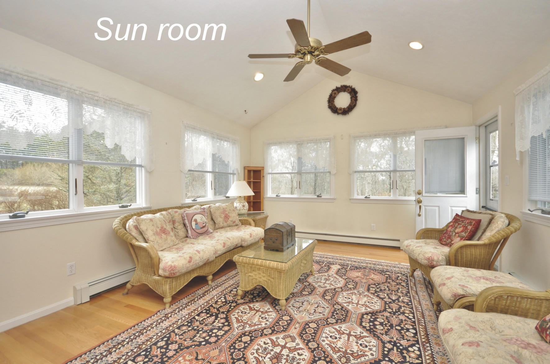 4 Oakbluff Road Sagamore Beach, MA 02562 - Photo 12 of 35 a living room with furniture wooden floor and a large window