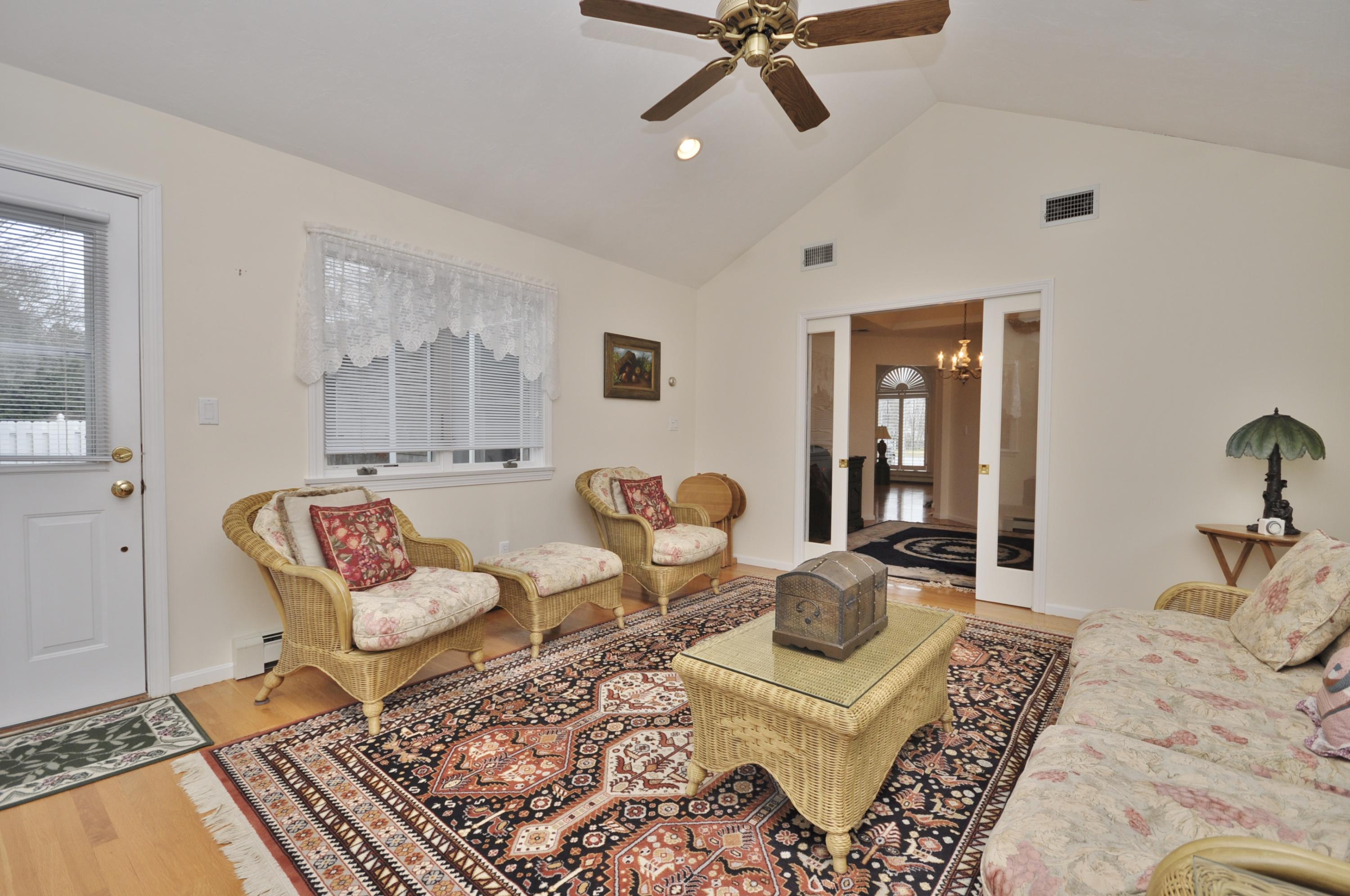 4 Oakbluff Road Sagamore Beach, MA 02562 - Photo 13 of 35 a living room with furniture and a rug