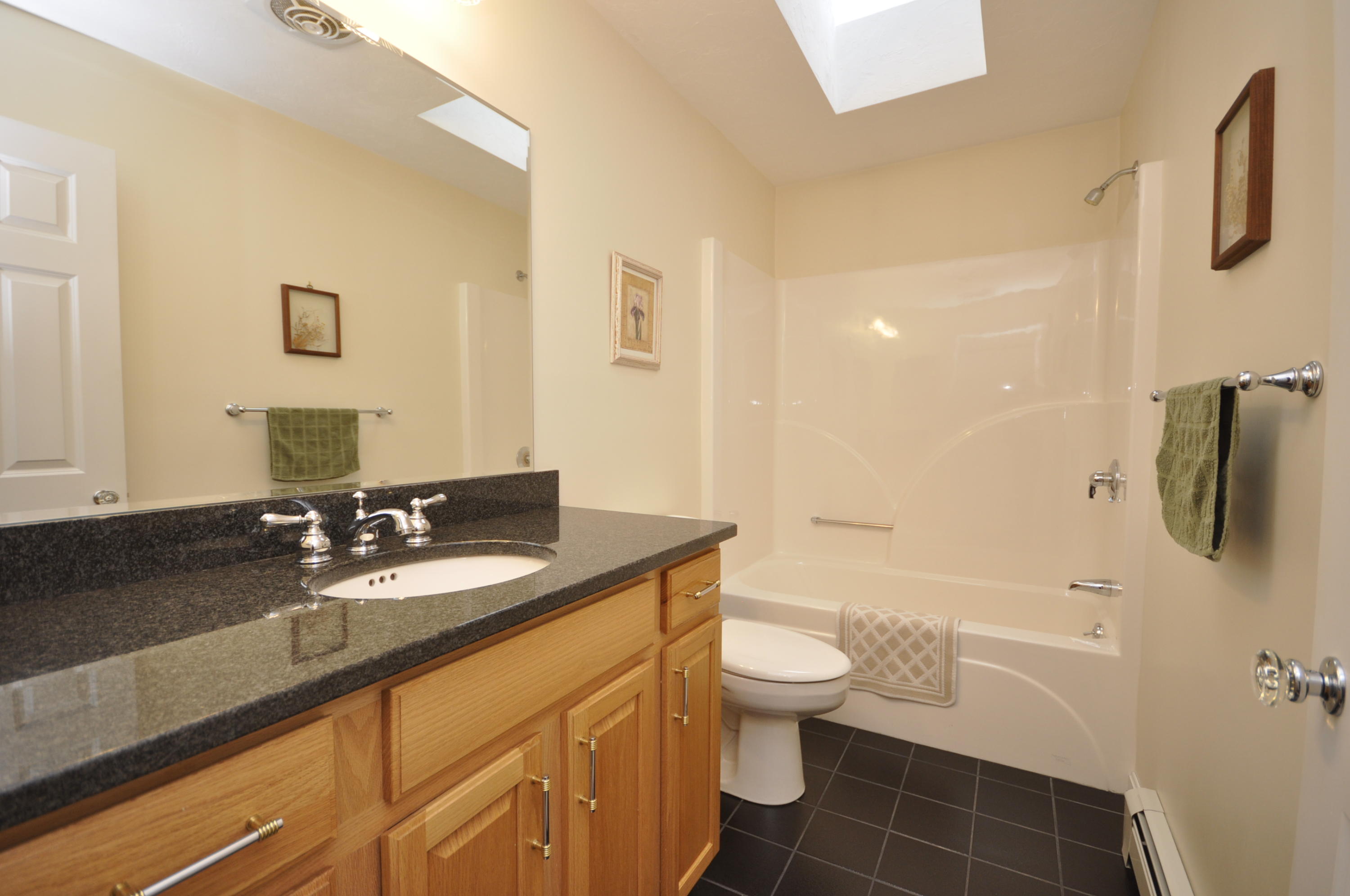 4 Oakbluff Road Sagamore Beach, MA 02562 - Photo 14 of 35 a bathroom with a granite countertop sink a toilet and shower