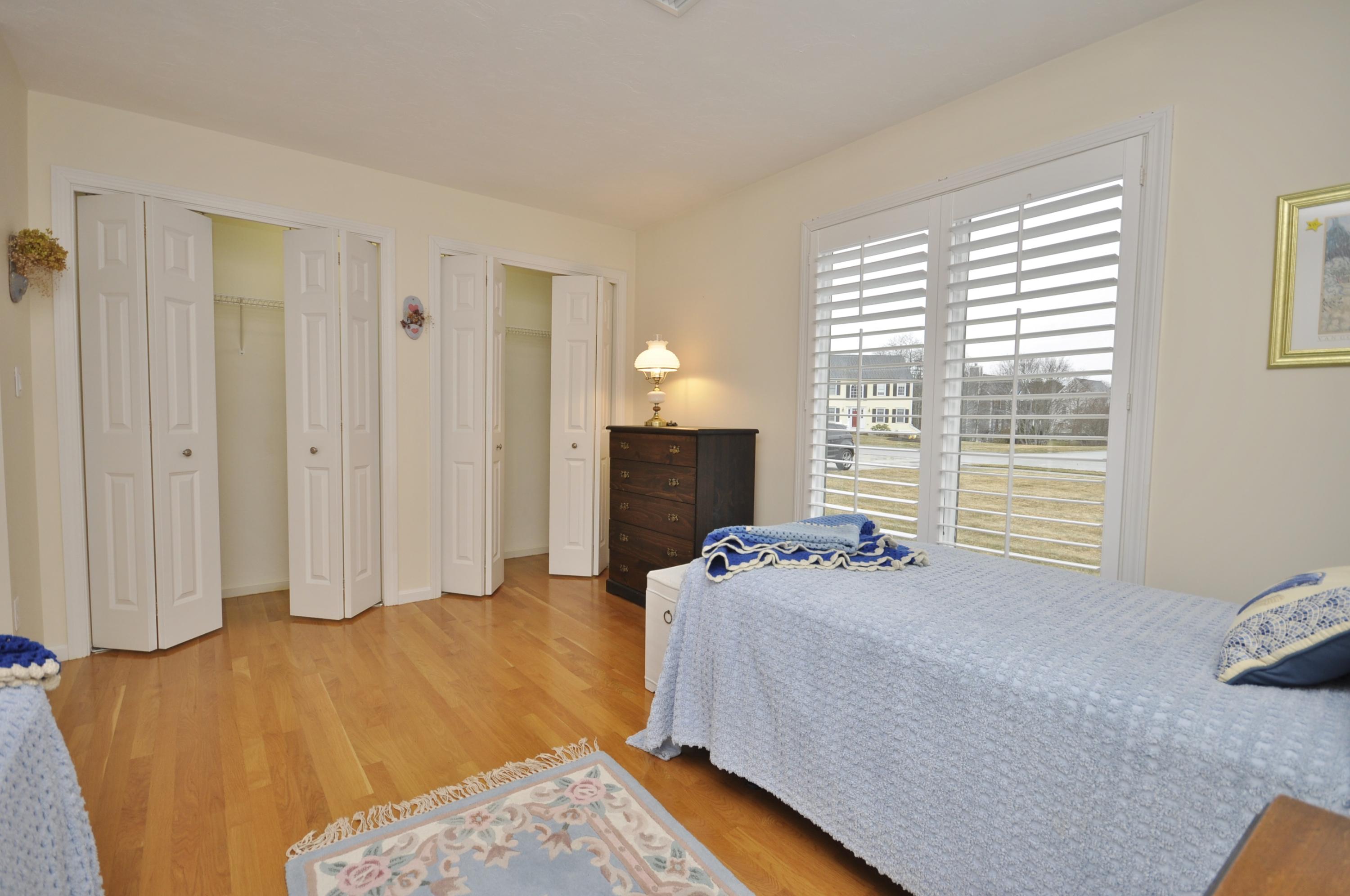 4 Oakbluff Road Sagamore Beach, MA 02562 - Photo 15 of 35 a bedroom with a bed and a window
