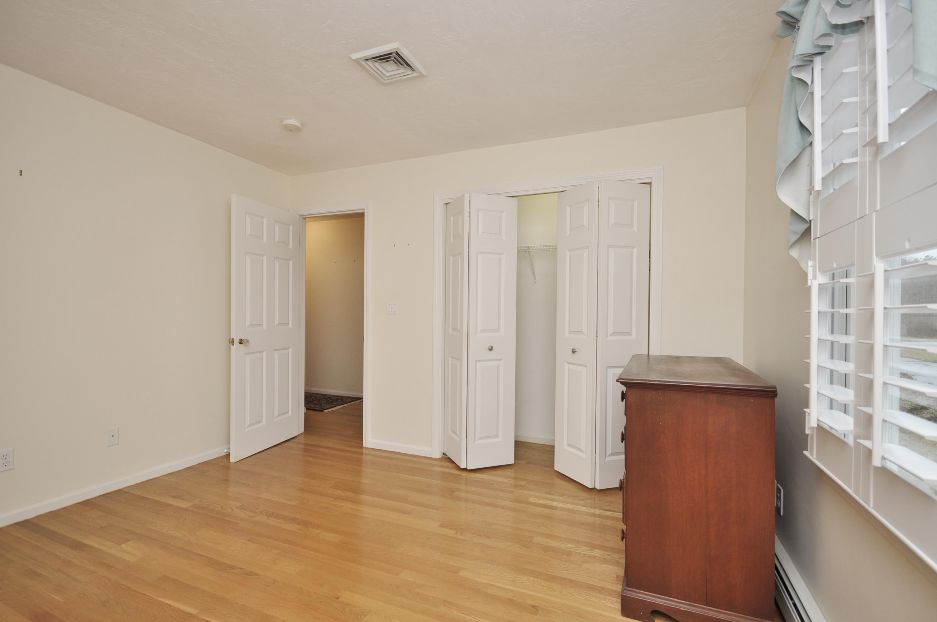 4 Oakbluff Road Sagamore Beach, MA 02562 - Photo 17 of 35 a view of a livingroom with wooden floor and windows