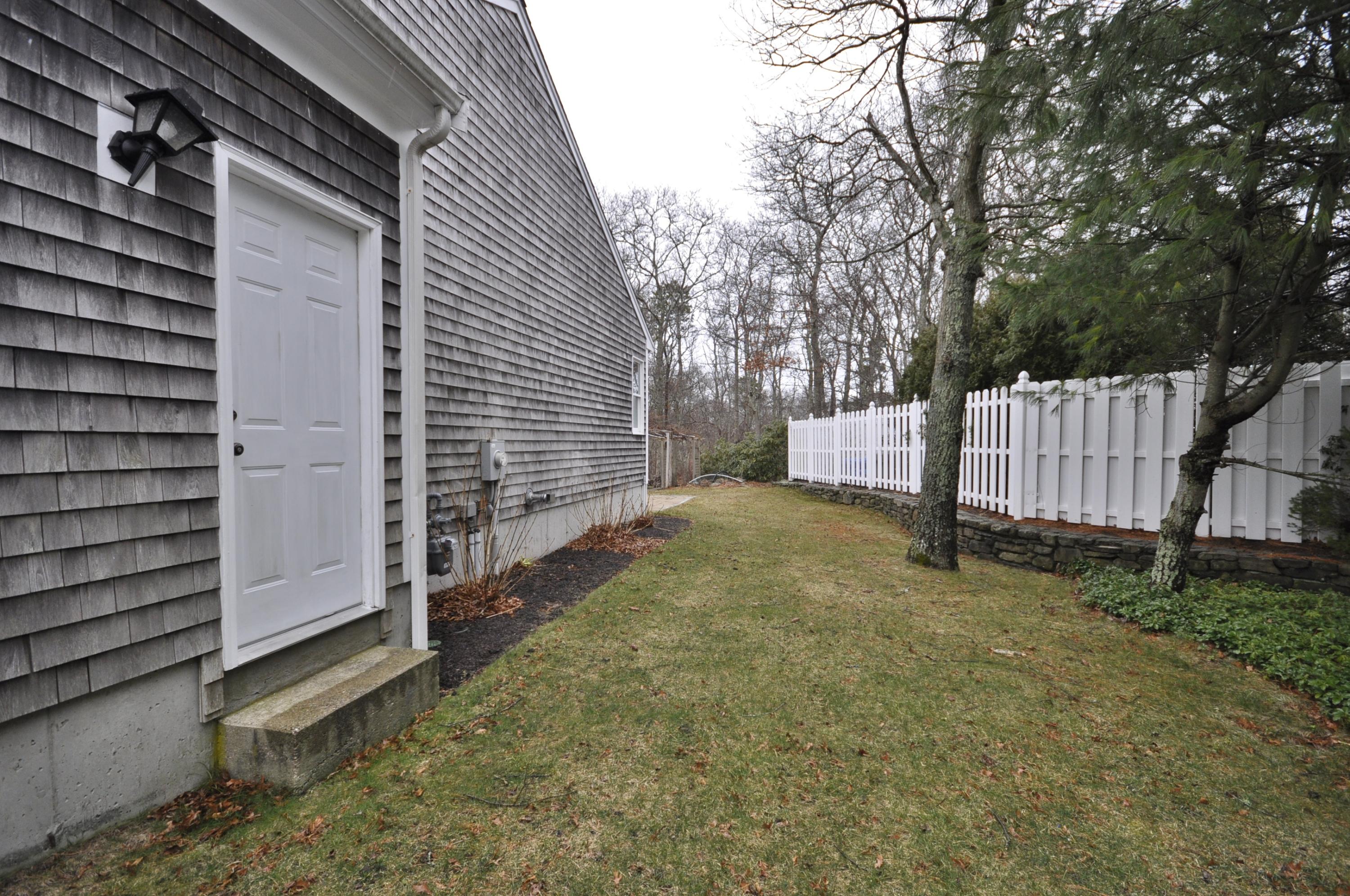 4 Oakbluff Road Sagamore Beach, MA 02562 - Photo 30 of 35 a view of backyard and tree