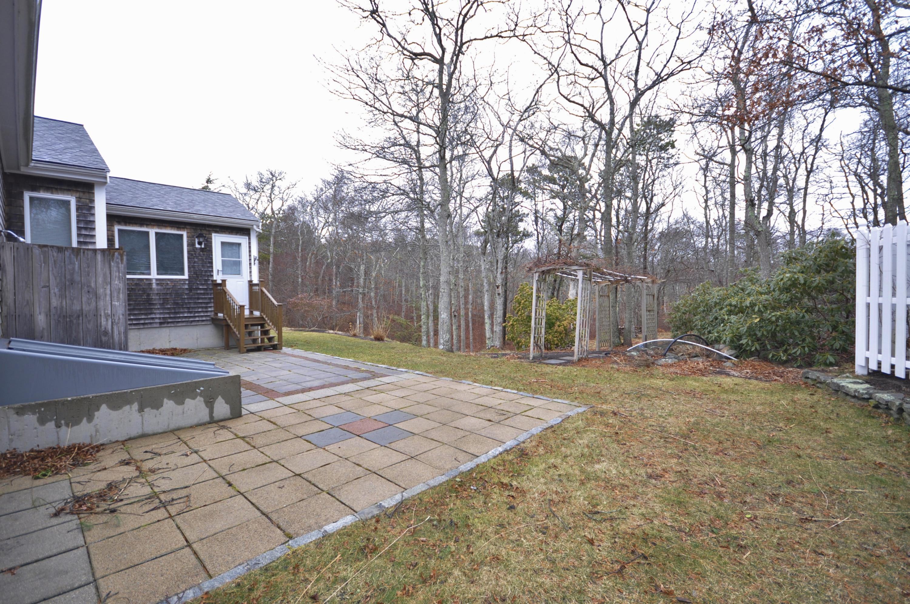 4 Oakbluff Road Sagamore Beach, MA 02562 - Photo 31 of 35 a view of a backyard with large trees