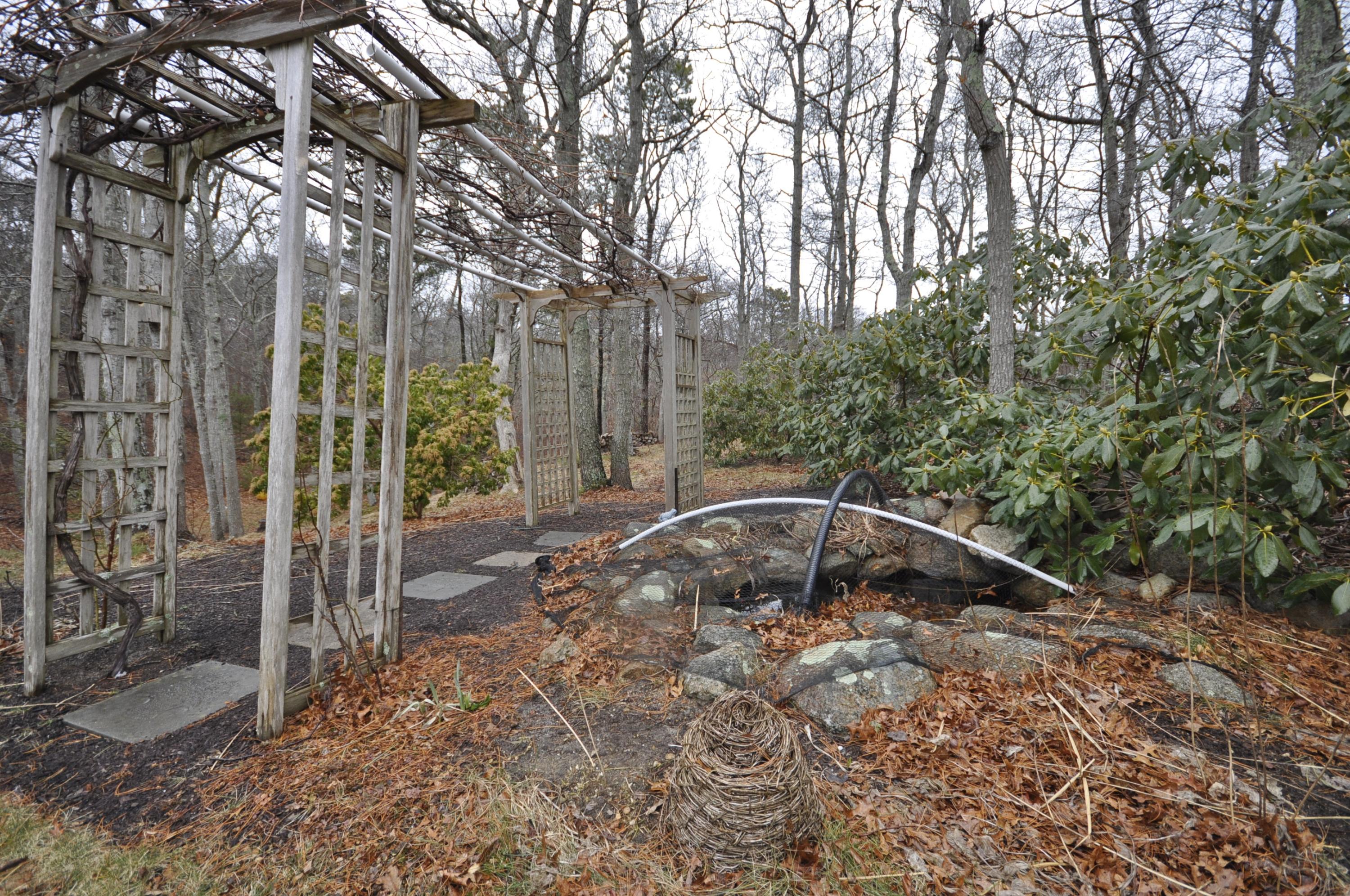 4 Oakbluff Road Sagamore Beach, MA 02562 - Photo 32 of 35 a backyard of a house with lots of green space