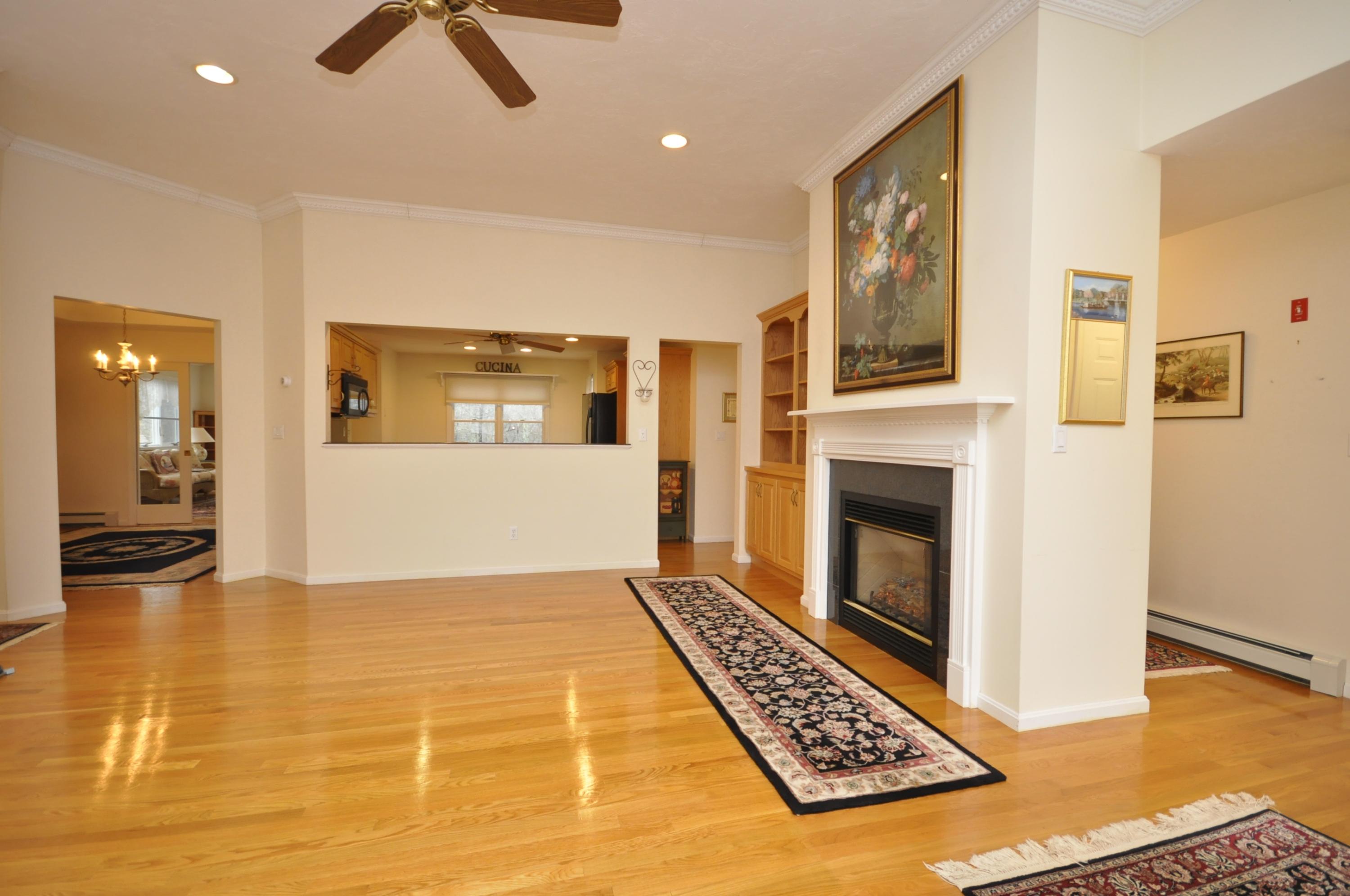 4 Oakbluff Road Sagamore Beach, MA 02562 - Photo 8 of 35 a living room with furniture and a fireplace