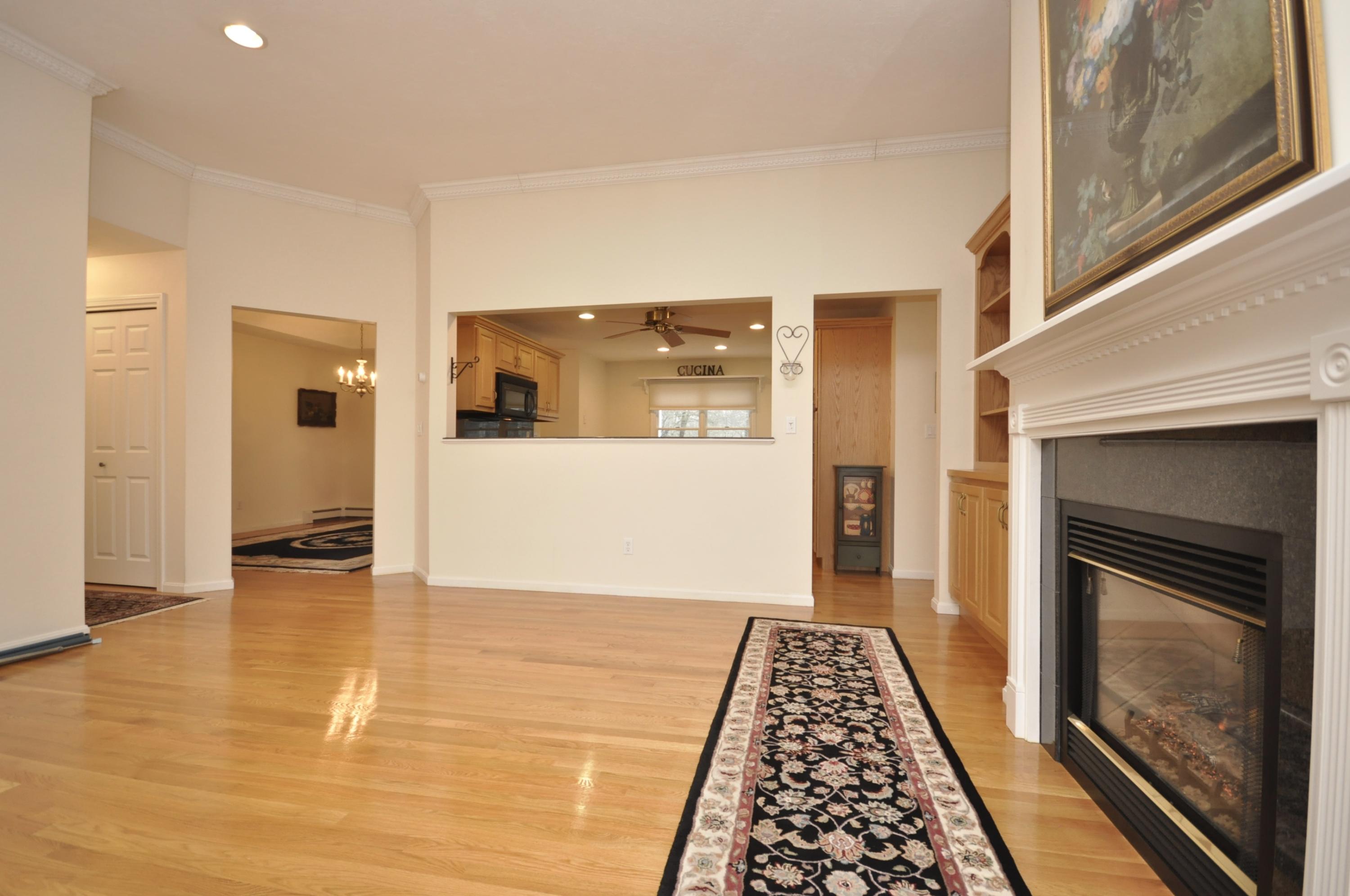 4 Oakbluff Road Sagamore Beach, MA 02562 - Photo 9 of 35 a view of a hallway view with wooden floor and a fireplace