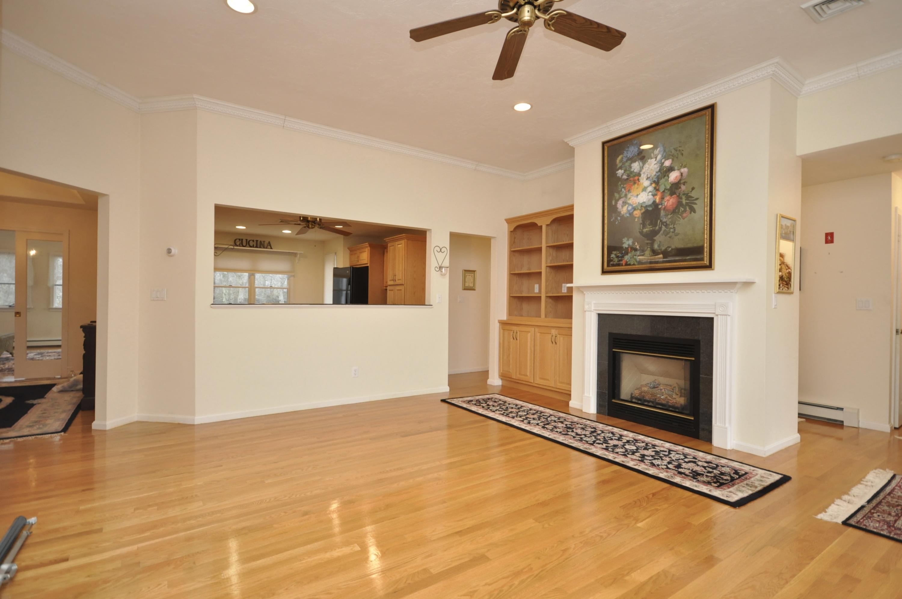 4 Oakbluff Road Sagamore Beach, MA 02562 - Photo 10 of 35 a view of a livingroom with a fireplace and window