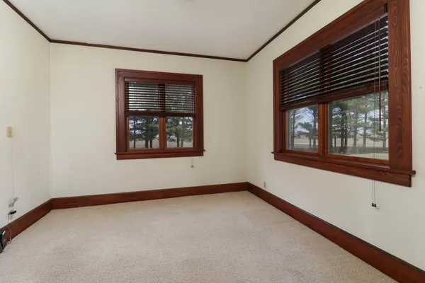 a view of a livingroom with furniture and a ceiling fan
