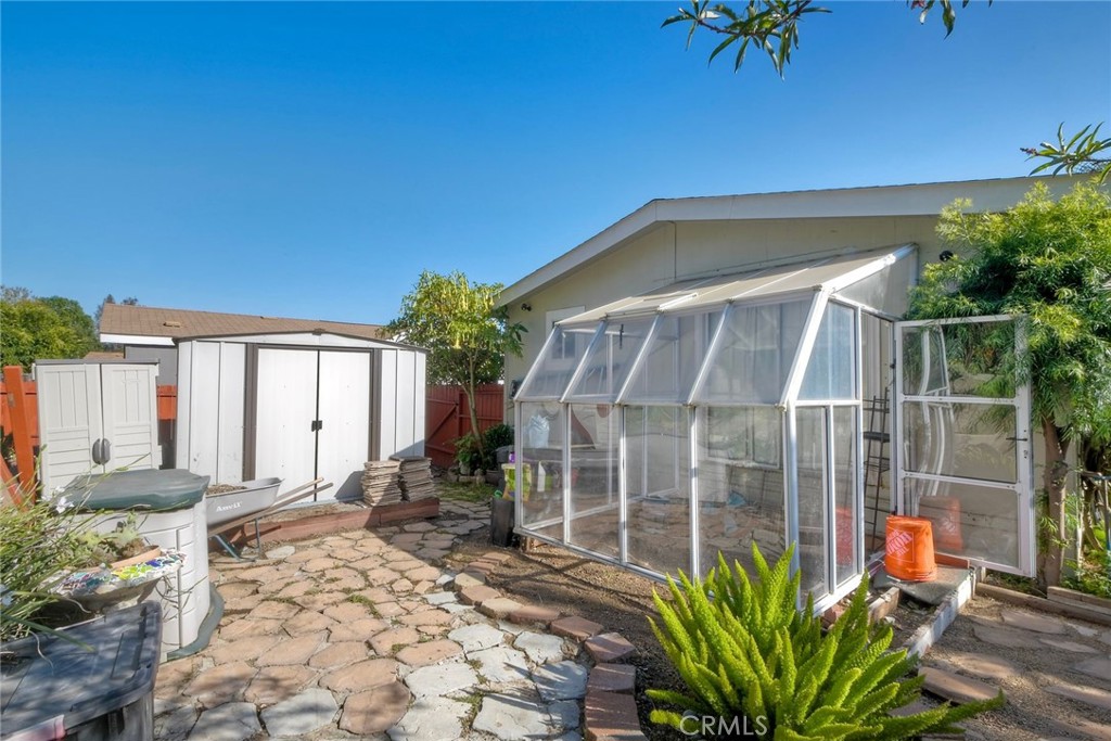 3909 Reche Road, Unit 125 Fallbrook, CA 92028 - Photo 32 of 58 a house view with a seating space and garden view
