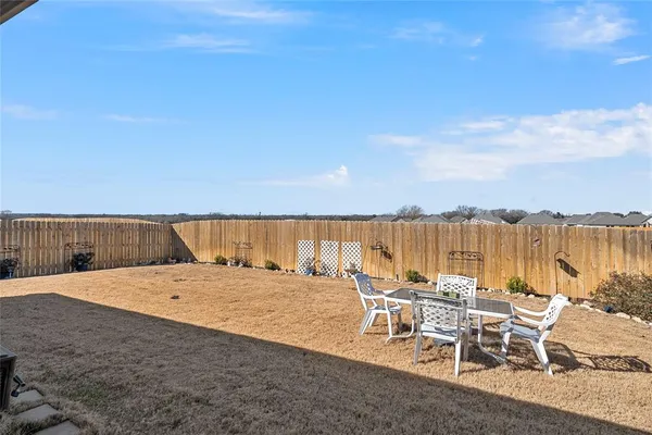 an outdoor space with furniture and ocean view