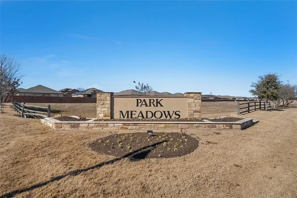 a view of a street with a building in the background