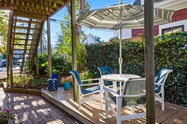 a view of a chairs and table in the patio