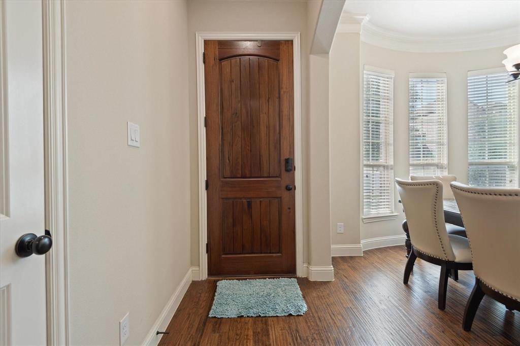 3615 Adriana Avenue Irving, TX 75038 - Photo 2 of 33 a view of a room with wooden floor and windows