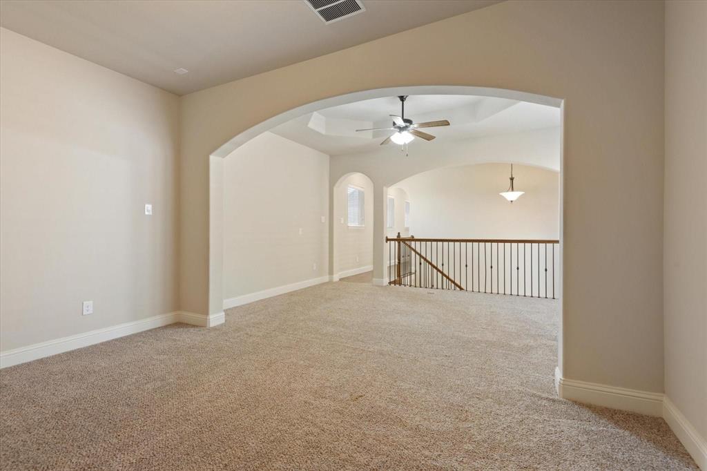 3615 Adriana Avenue Irving, TX 75038 - Photo 23 of 33 a view of a hallway with a ceiling fan