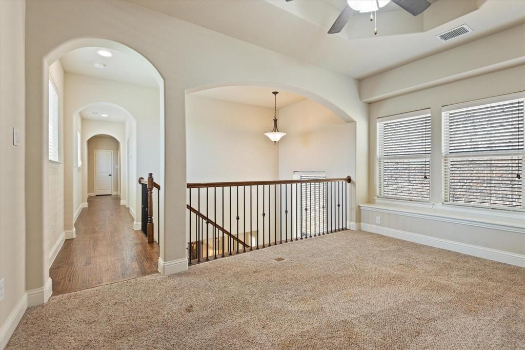 3615 Adriana Avenue Irving, TX 75038 - Photo 25 of 33 a view of a hallway with windows