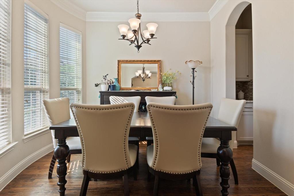 3615 Adriana Avenue Irving, TX 75038 - Photo 4 of 33 a view of a dining room with furniture window and wooden floor