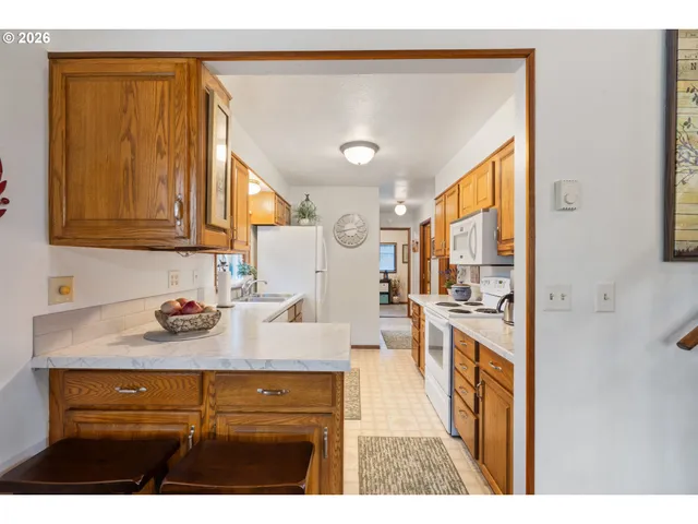 a view of living room with granite countertop furniture and fireplace