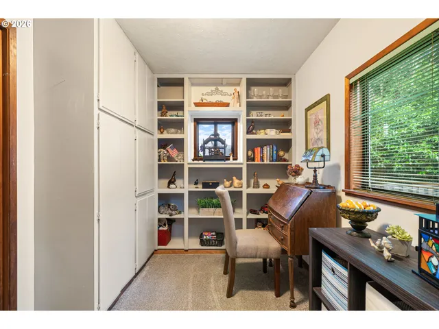 a work room with furniture and a window