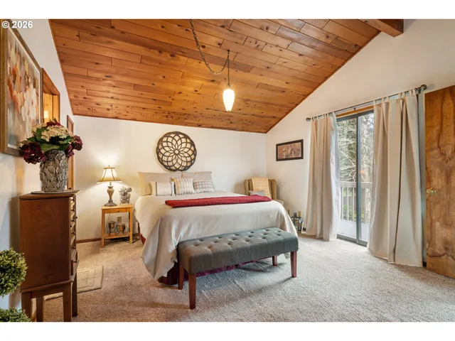 a bed room with a bed and a chandelier