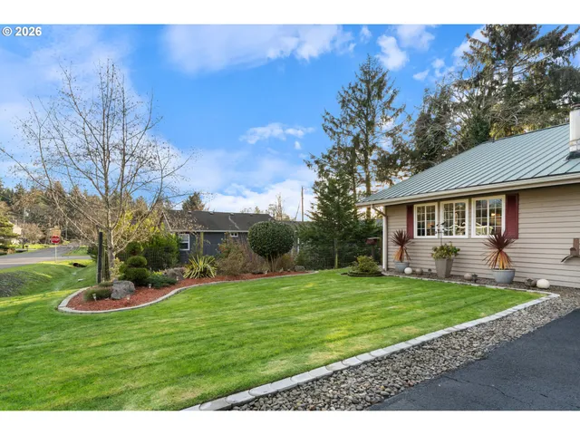 a view of a house with a yard