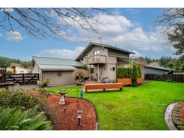 a view of a house with a yard porch and sitting area