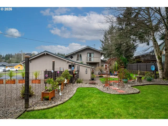 a aerial view of a house with swimming pool and garden