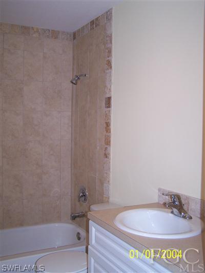 8433 Bamboo Road Fort Myers, FL 33967 - Photo 6 of 9 a bathroom with a sink and a bathtub