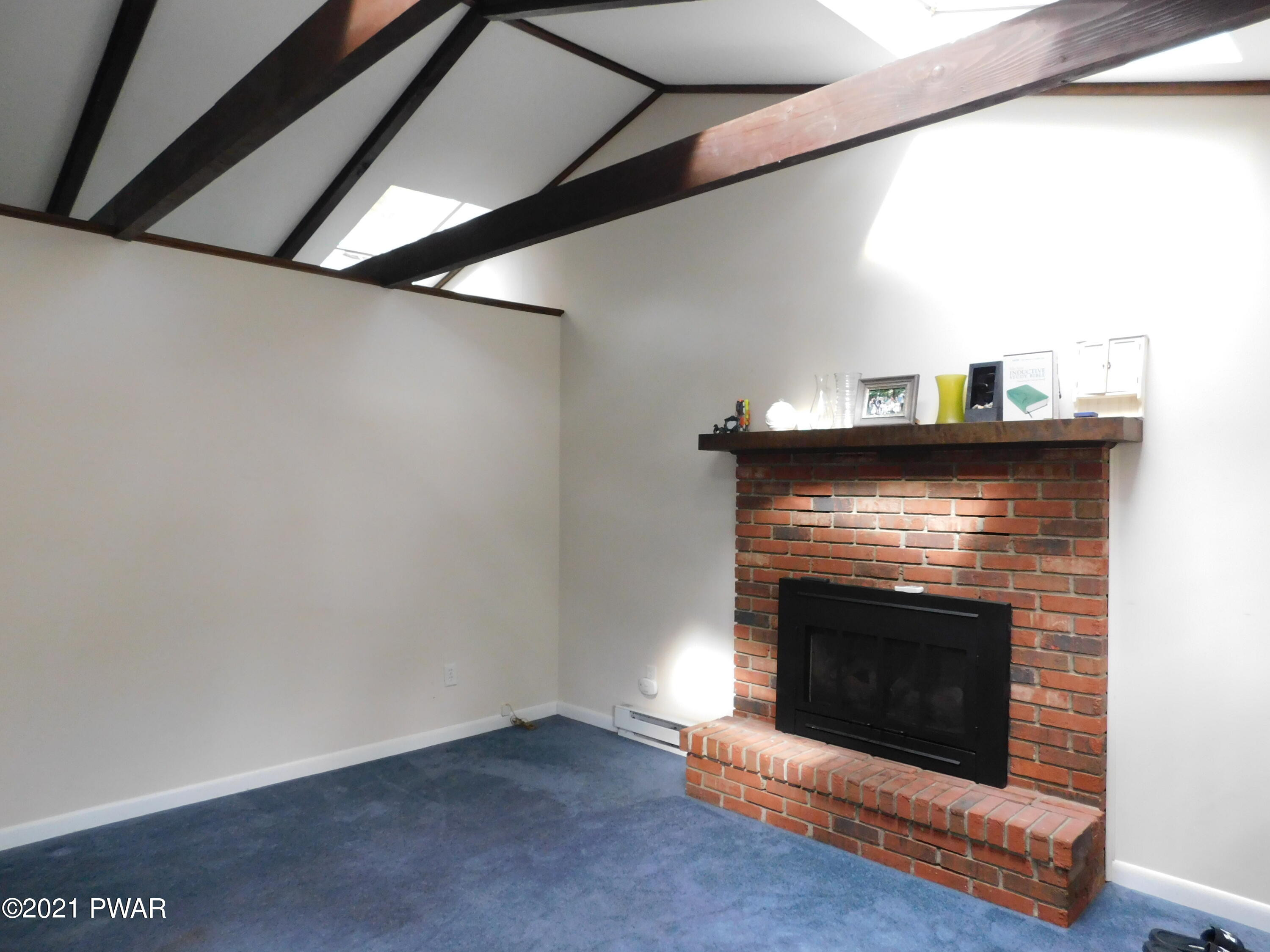 119 Ridge Drive Milford, PA 18337 - Photo 11 of 40 a living room with a fireplace in it