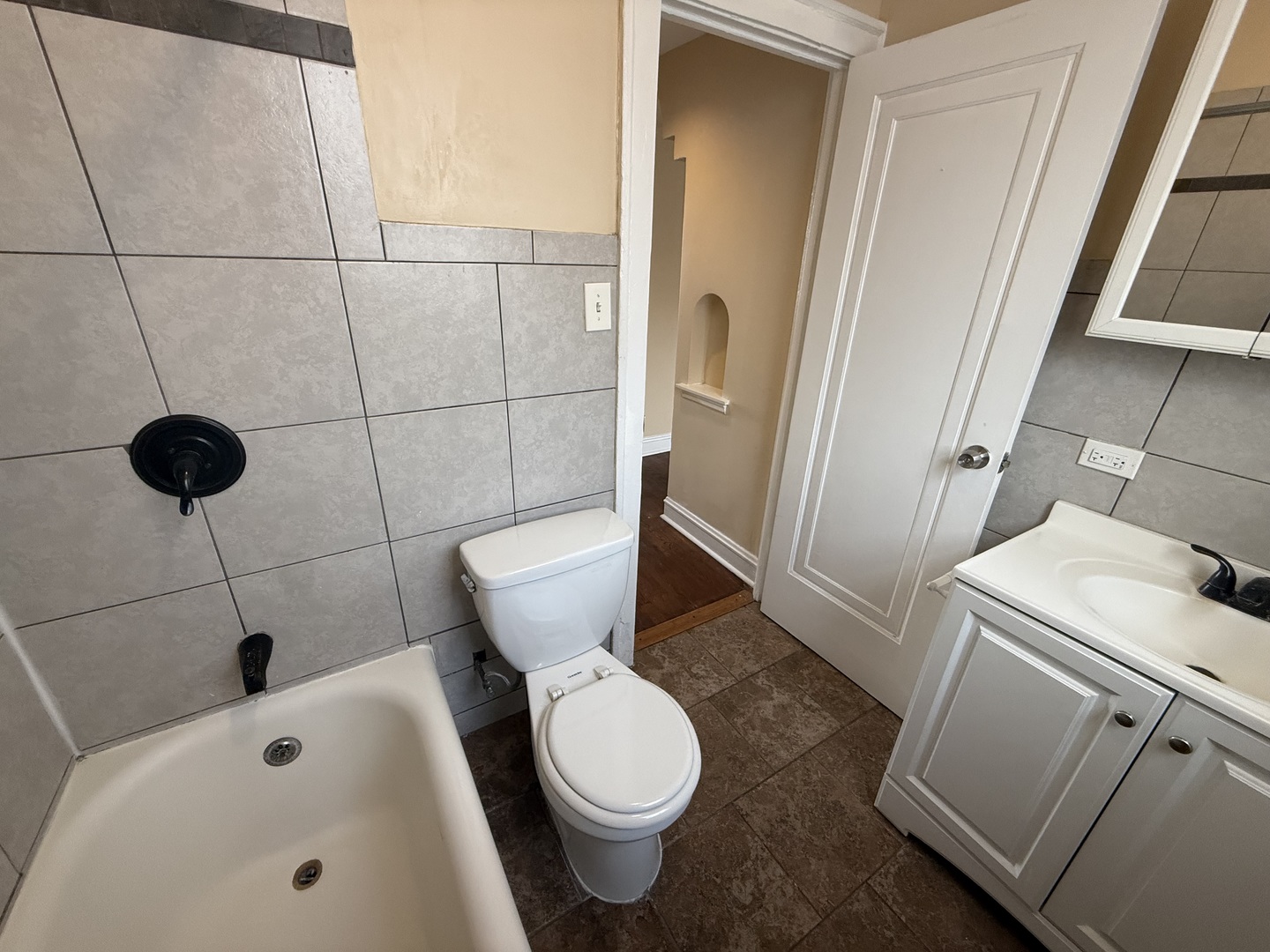 2805 North Kilbourn Avenue, Unit 3S Chicago, IL 60639 - Photo 12 of 13 a white toilet sitting next to a bathroom sink and a shower