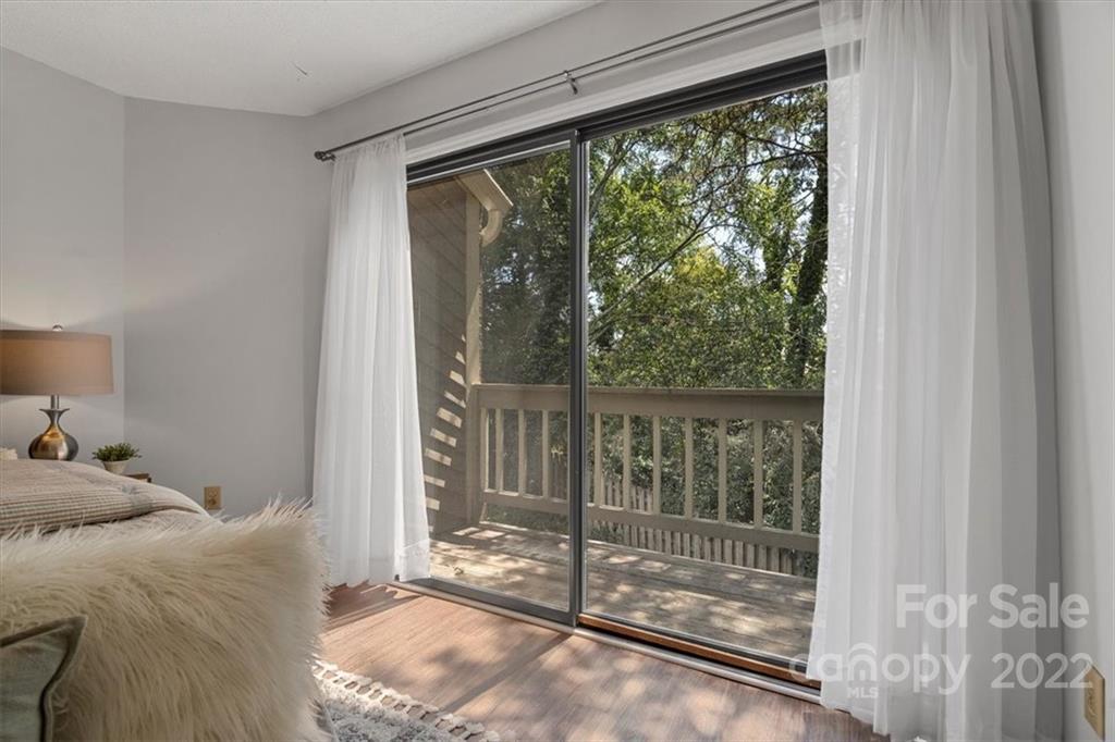 1606 Sharon Road West Charlotte, NC 28210 - Photo 12 of 19 a bed sitting in a bedroom next to a window