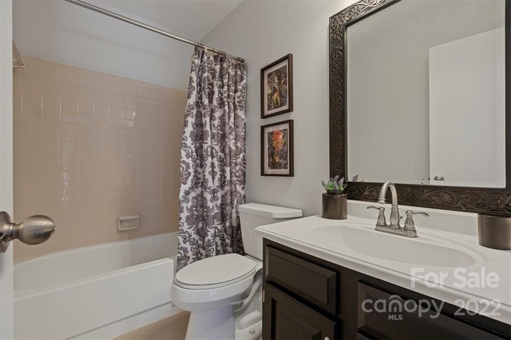 1606 Sharon Road West Charlotte, NC 28210 - Photo 16 of 19 a bathroom with a sink toilet and shower
