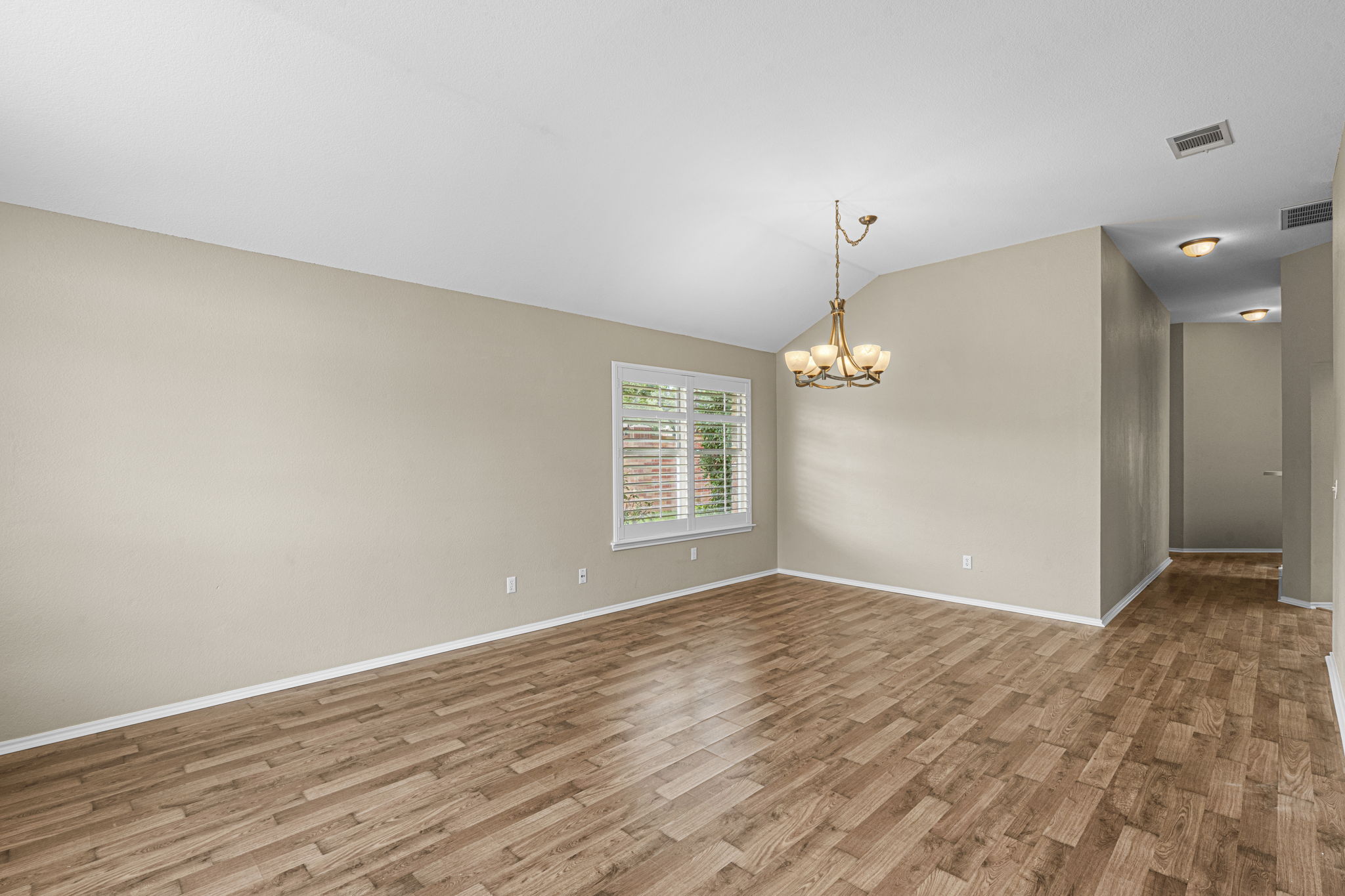 7172 Ridge Oak Road Austin, TX 78749 - Photo 15 of 40 A refined dining space featuring rich wood flooring and a classic chandelier, ideal for entertaining.
