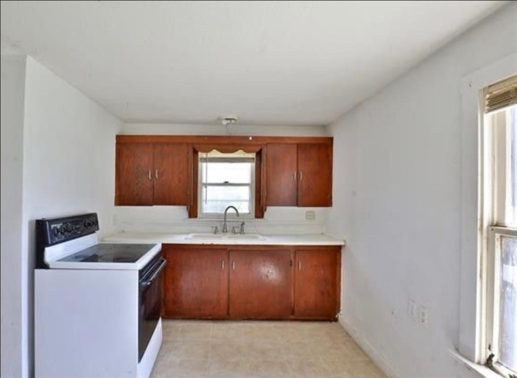 10971 West Lake Road Abilene, TX 79601 - Photo 11 of 17 a room with a sink cabinets and window