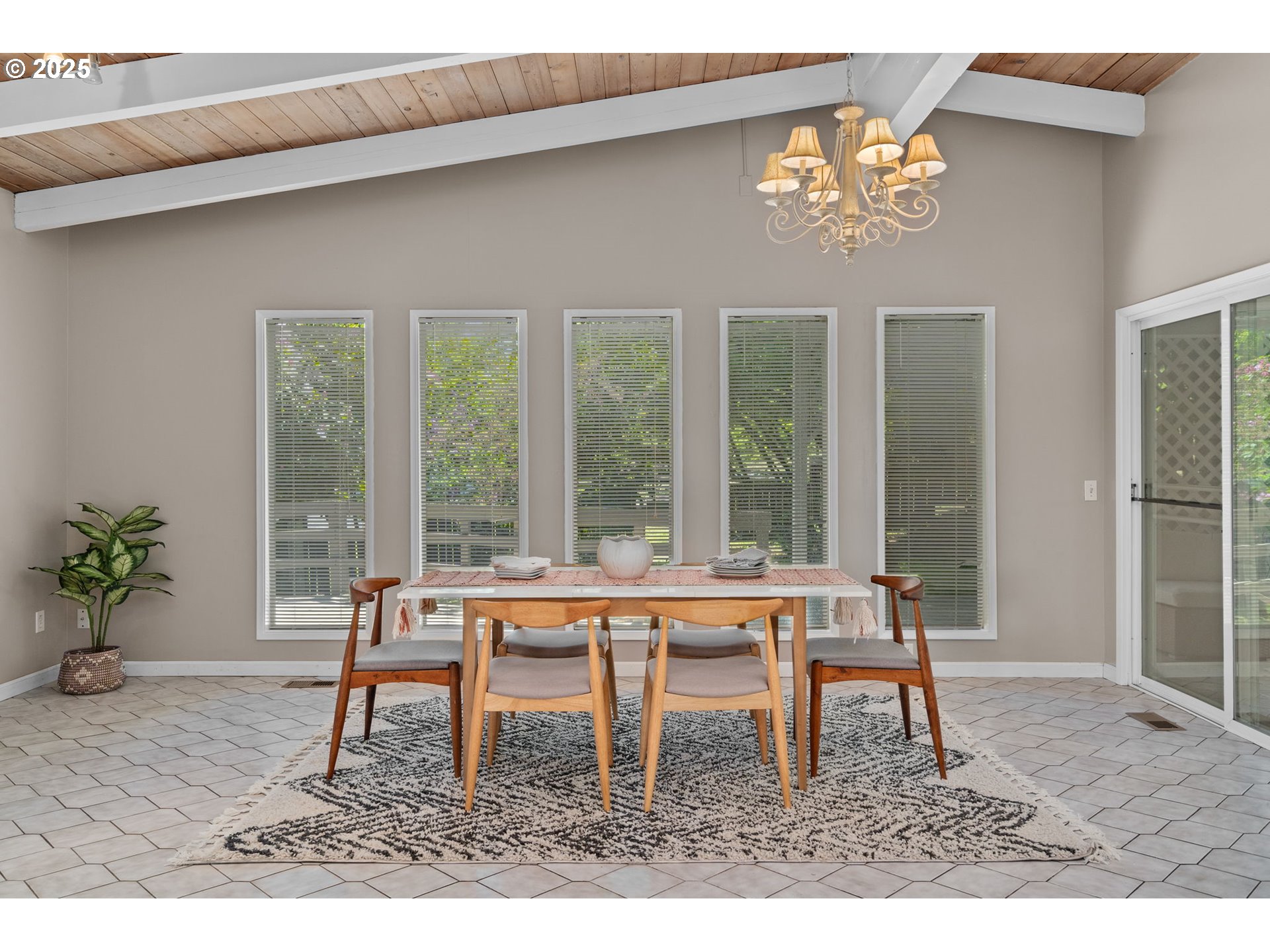 32314 Southeast Oxbow Drive Gresham, OR 97080 - Photo 14 of 40 a living room with a table chairs and a potted plant