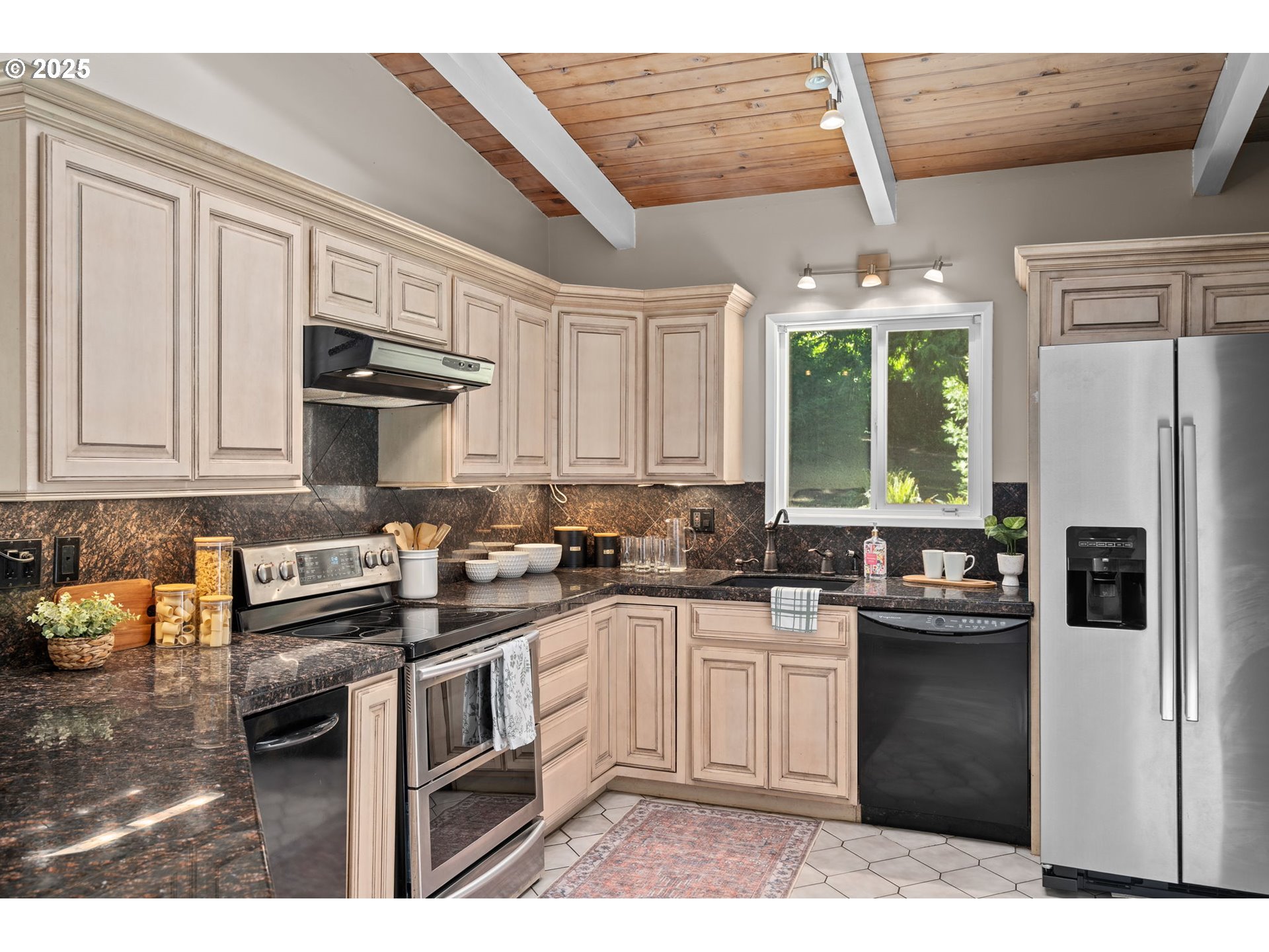 32314 Southeast Oxbow Drive Gresham, OR 97080 - Photo 18 of 40 a kitchen with stainless steel appliances granite countertop a stove sink refrigerator and cabinets