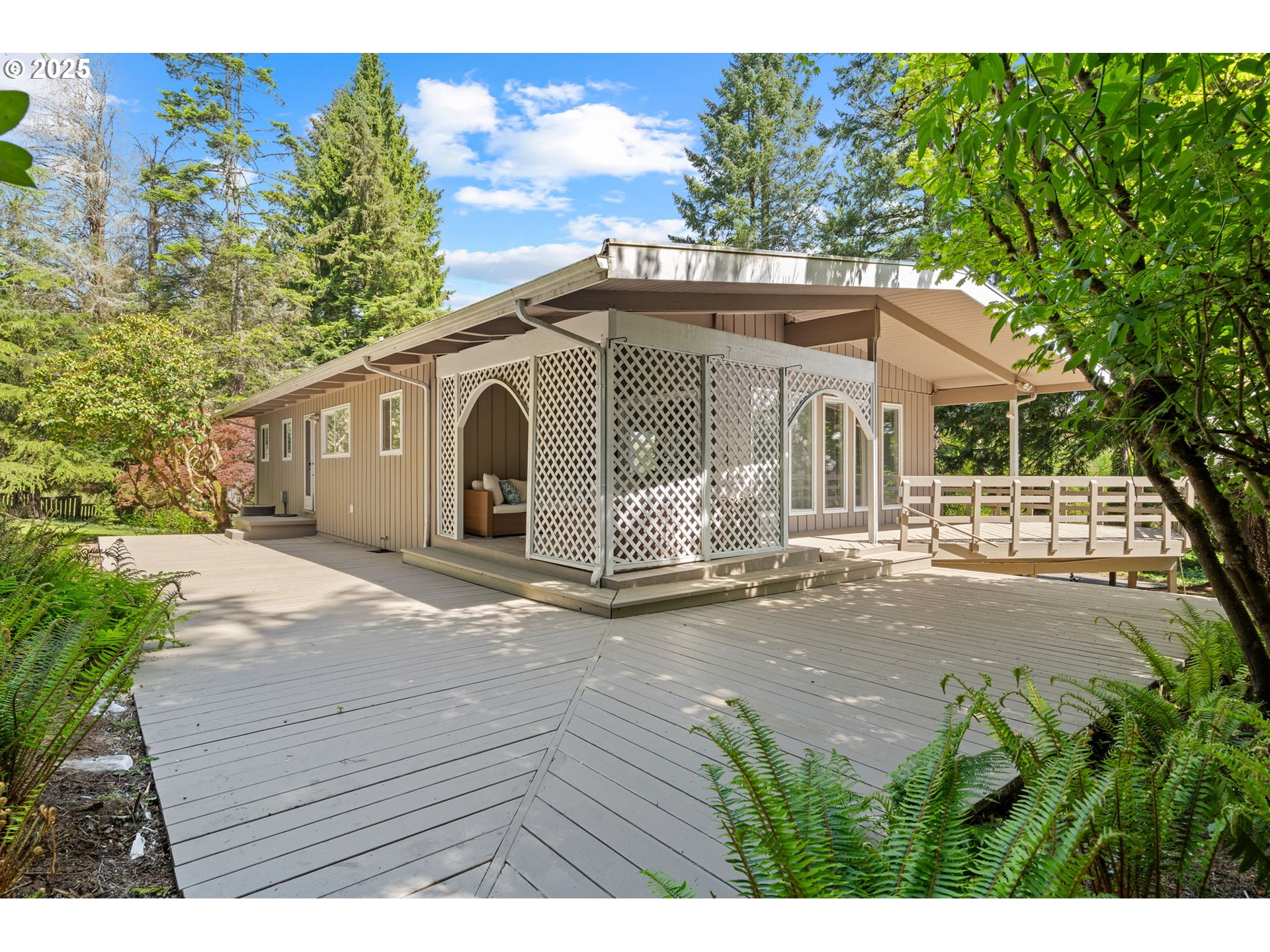 32314 Southeast Oxbow Drive Gresham, OR 97080 - Photo 2 of 40 a front view of a house with a yard and garage