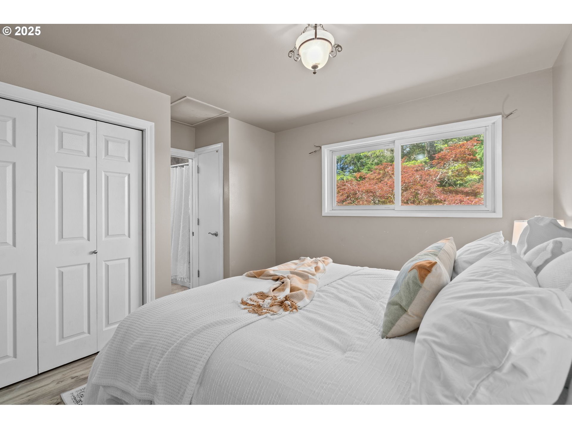 32314 Southeast Oxbow Drive Gresham, OR 97080 - Photo 24 of 40 a bedroom with a bed and a painting