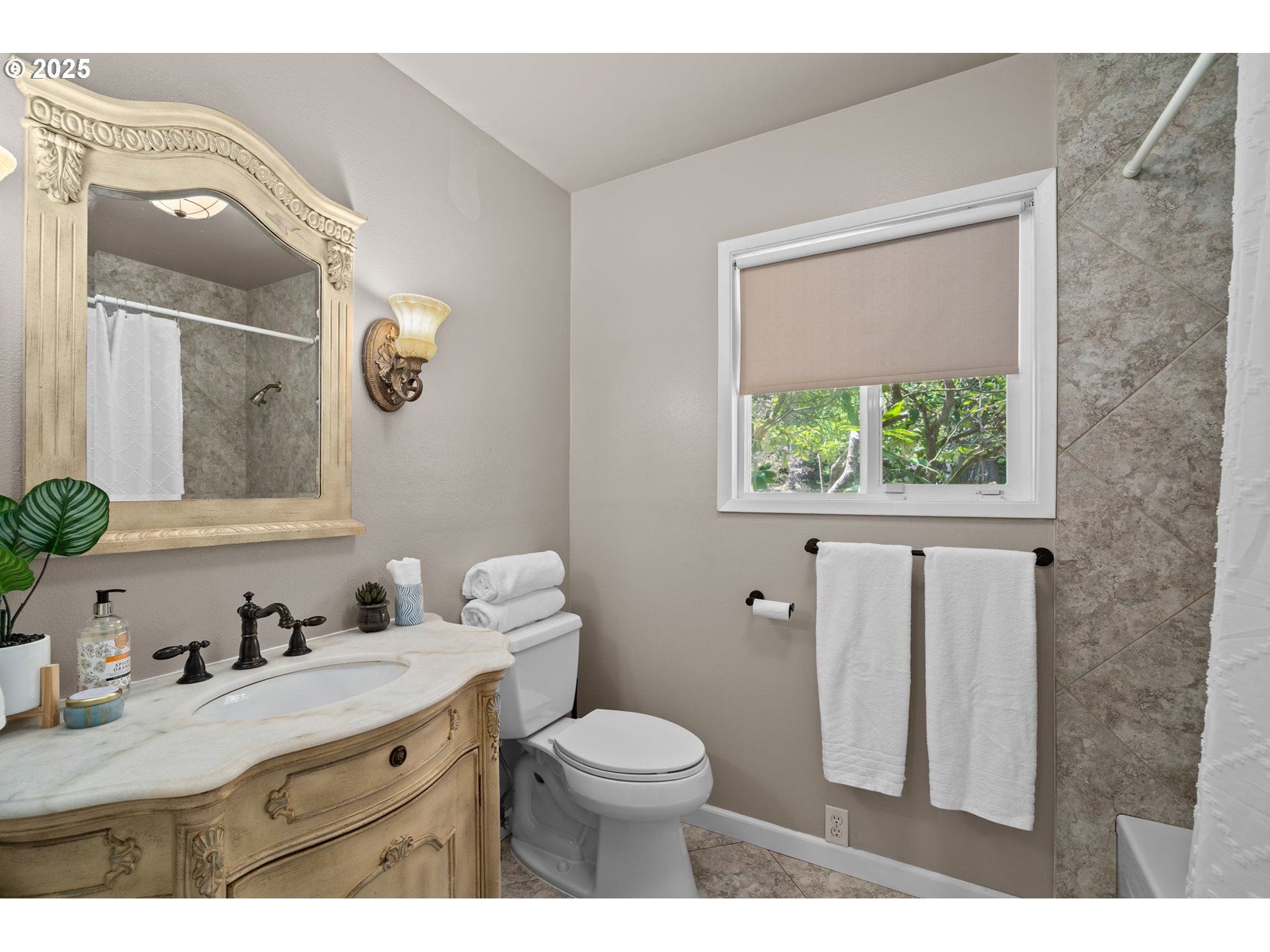 32314 Southeast Oxbow Drive Gresham, OR 97080 - Photo 25 of 40 a bathroom with a granite countertop toilet a sink a mirror and a window