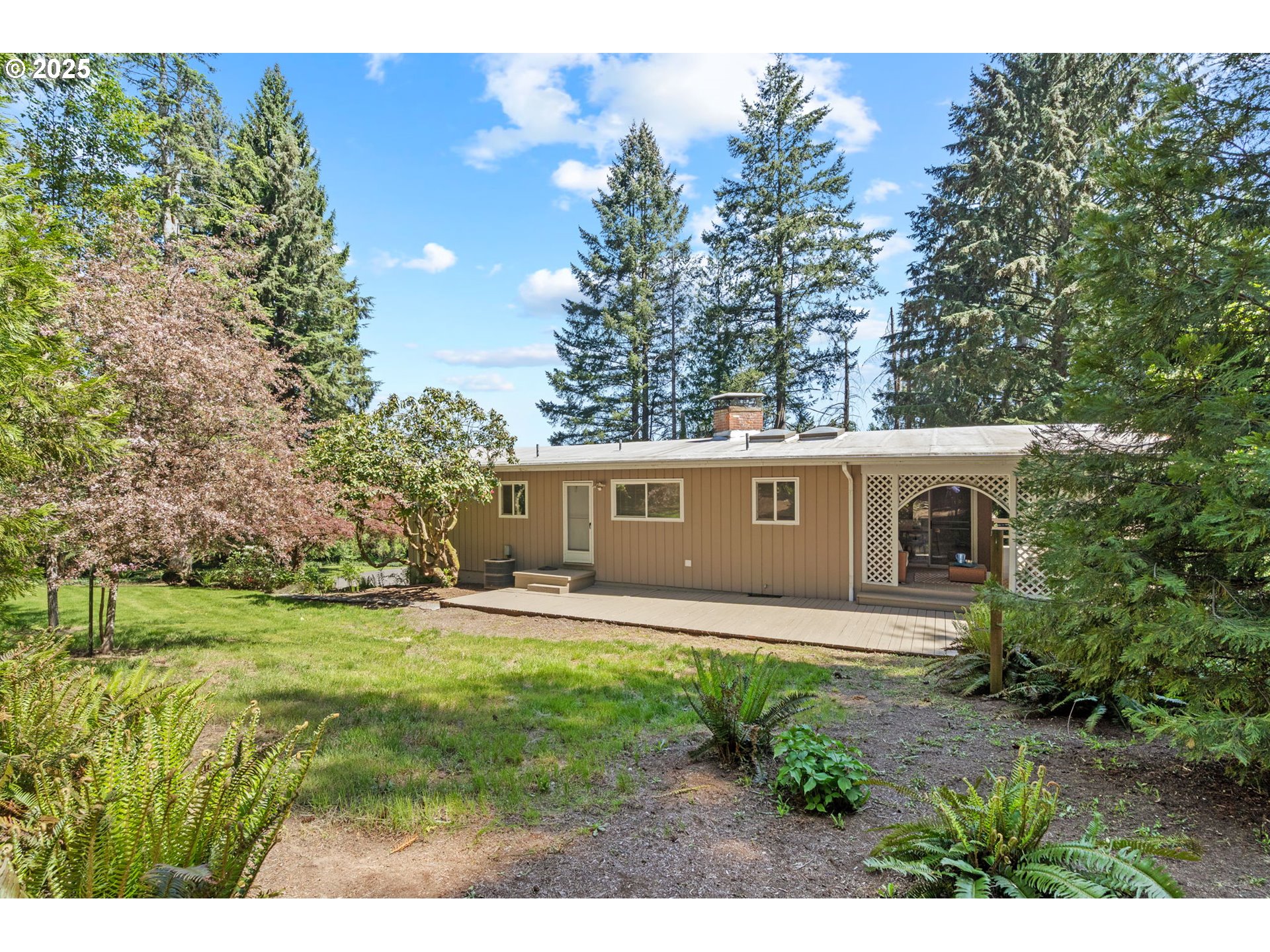 32314 Southeast Oxbow Drive Gresham, OR 97080 - Photo 3 of 40 a front view of a house with garden