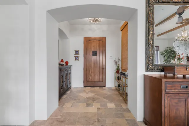 a open kitchen with a sink and a large window