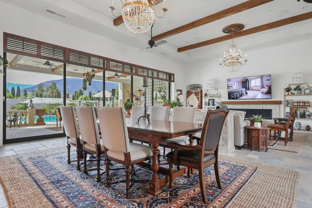 a living room with furniture and a kitchen