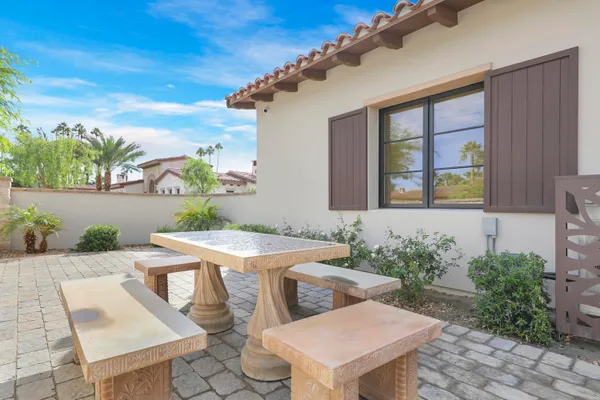 a kitchen with a dining table and chairs