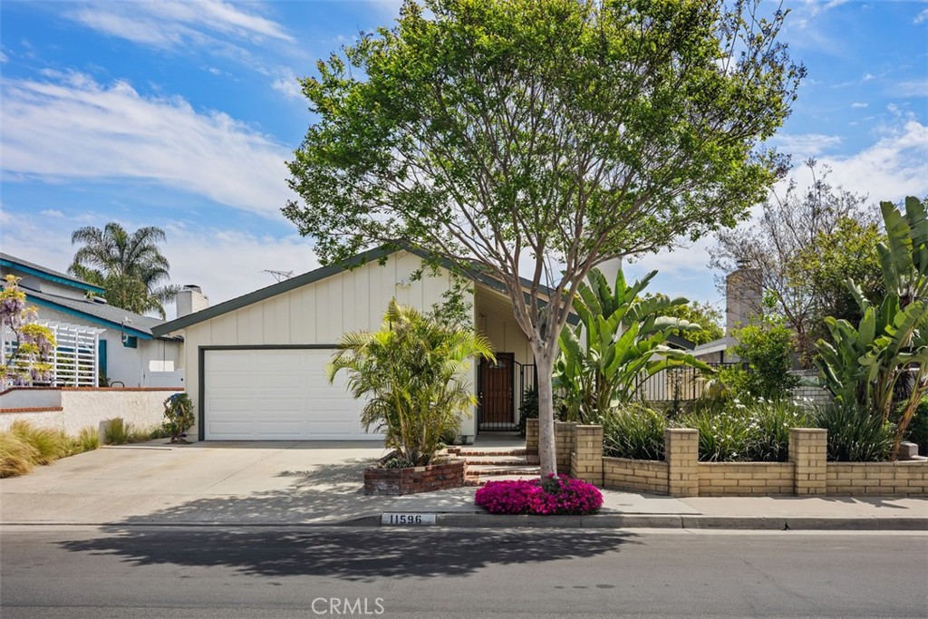 11596 Lakia Drive Cypress, CA 90630 - Photo 1 of 46 a front view of a house with garage