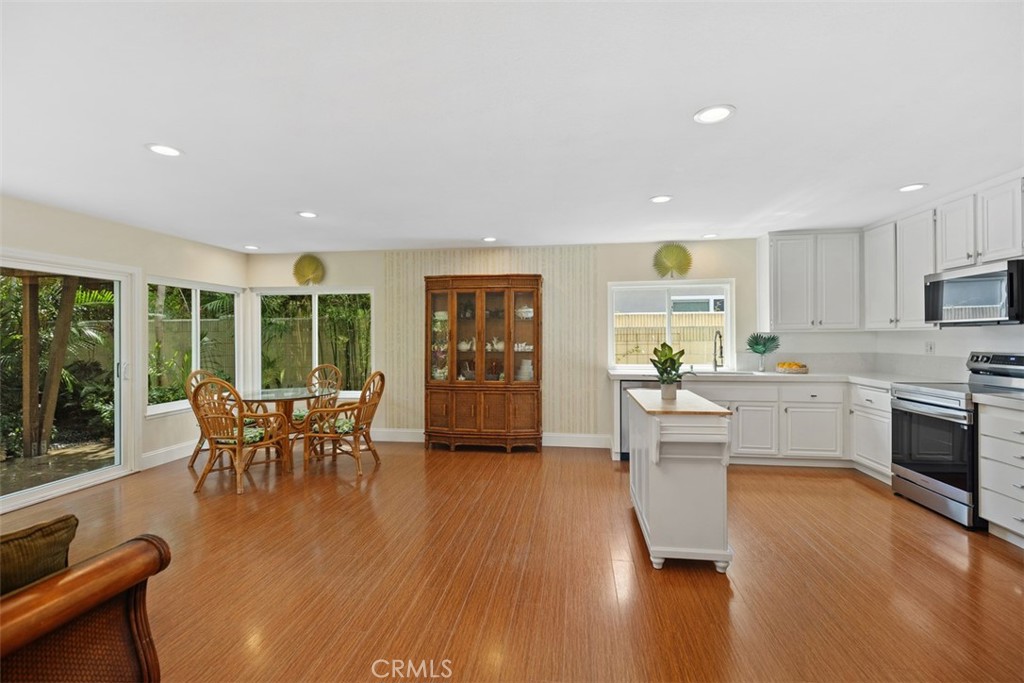 11596 Lakia Drive Cypress, CA 90630 - Photo 11 of 46 a dining room with furniture window and wooden floor