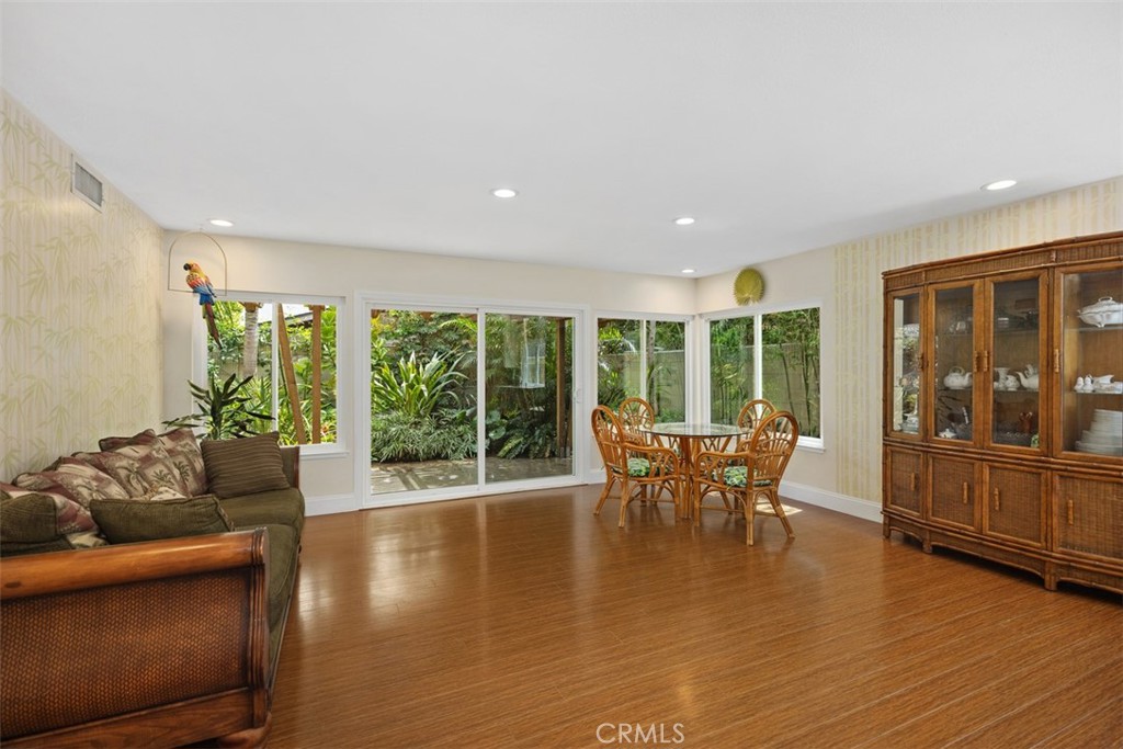 11596 Lakia Drive Cypress, CA 90630 - Photo 16 of 46 a dining room with furniture window and wooden floor