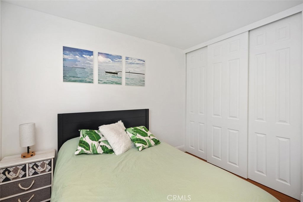 11596 Lakia Drive Cypress, CA 90630 - Photo 23 of 46 a bedroom with a bed and a window