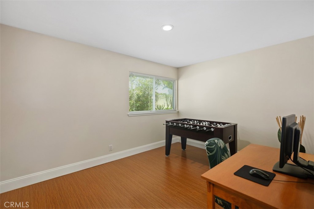11596 Lakia Drive Cypress, CA 90630 - Photo 24 of 46 a room with furniture and a window