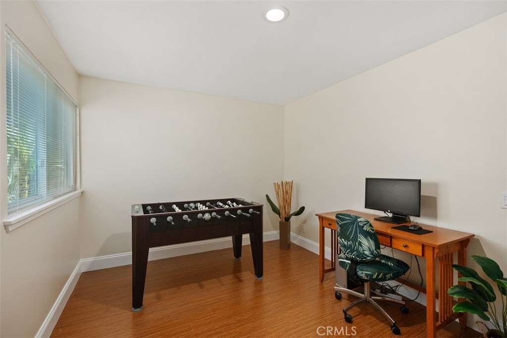 11596 Lakia Drive Cypress, CA 90630 - Photo 25 of 46 a view of a workspace with furniture and a window
