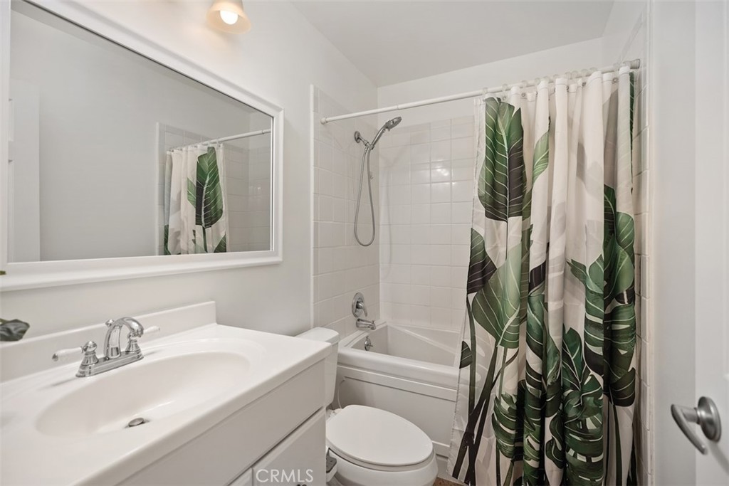 11596 Lakia Drive Cypress, CA 90630 - Photo 26 of 46 a bathroom with a sink toilet and shower