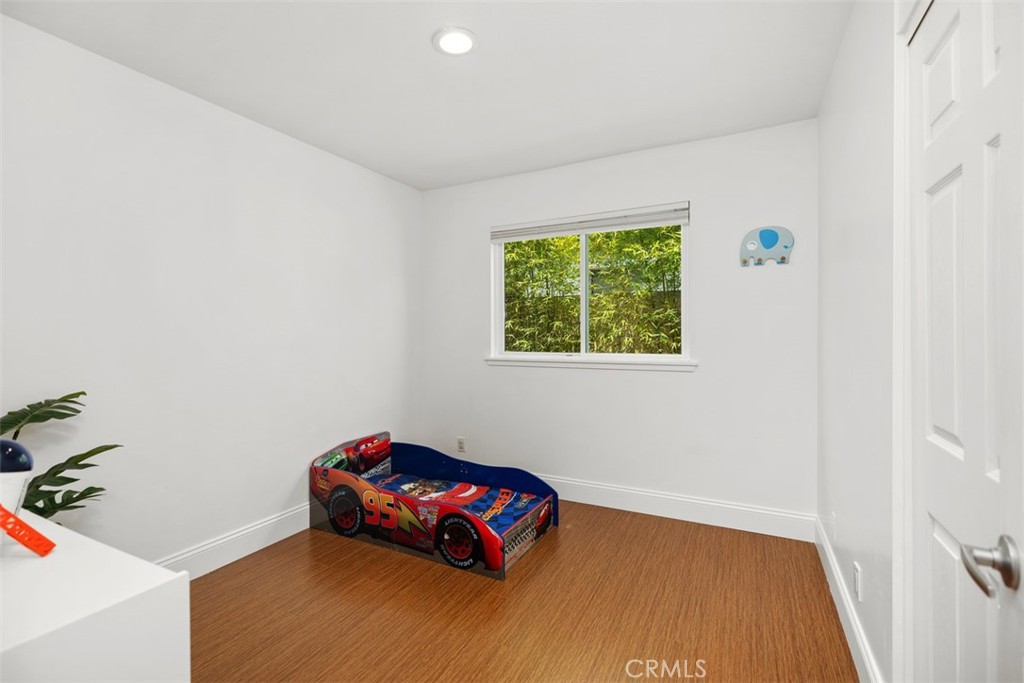 11596 Lakia Drive Cypress, CA 90630 - Photo 27 of 46 a room with furniture and a window